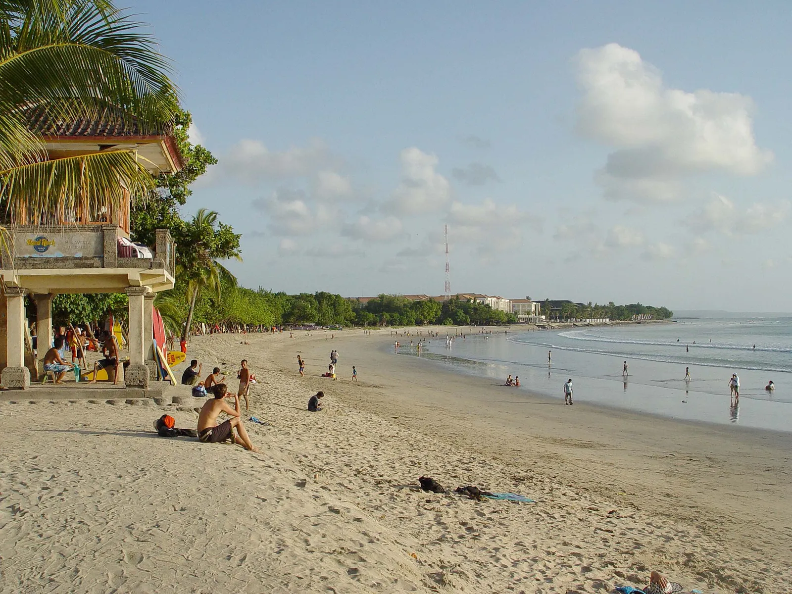 Lifeguard tower overlooking the long sandy curve of Kuta beach in Bali