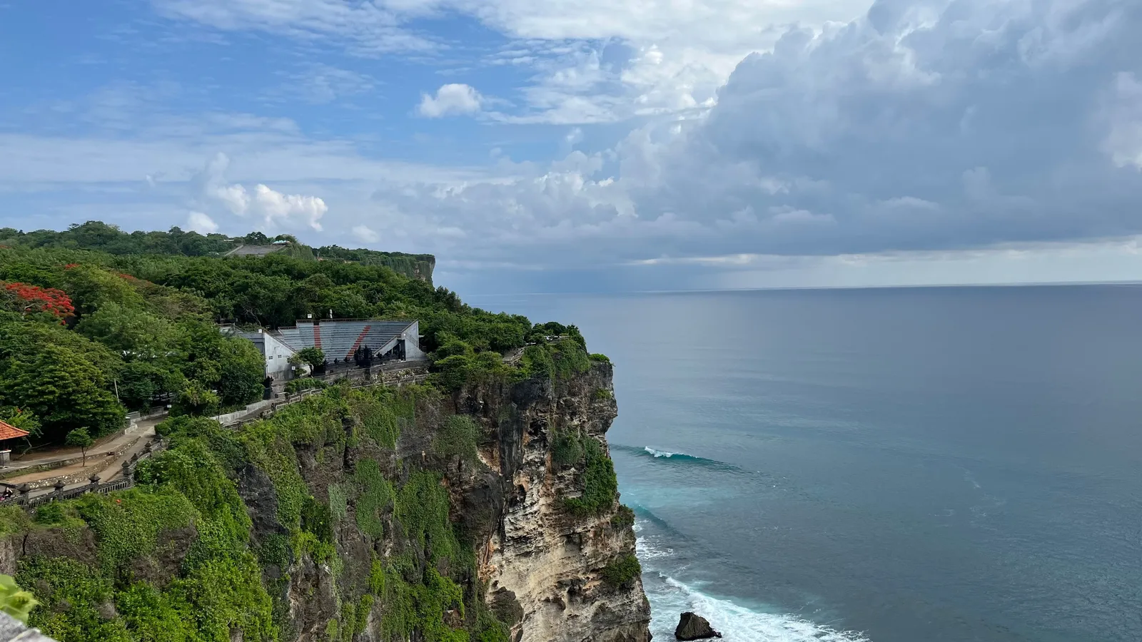 The limestone clifftop at Uluwatu in southern Bali with the temple above the ocean in afternoon light