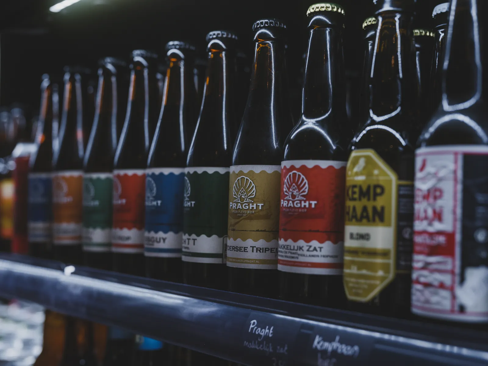 Sealed bottles of beer and branded spirits on shelves in a licensed Bali bottle shop