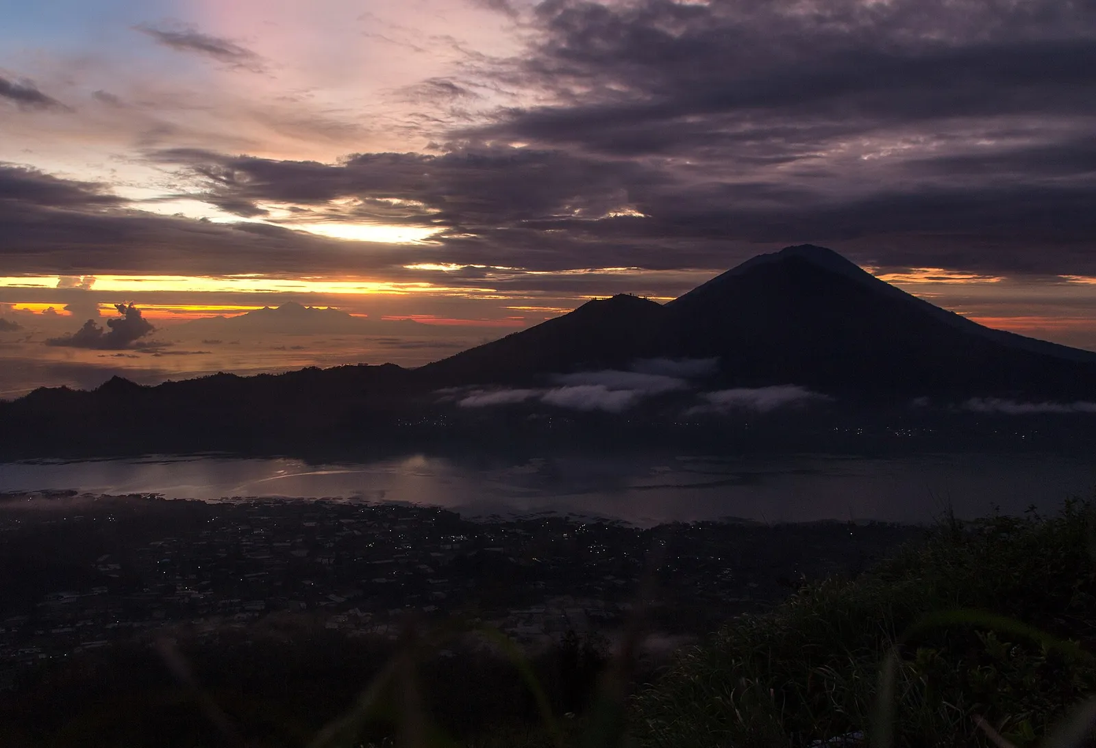 Sunrise over Lake Batur and Mount Agung seen from the Mount Batur summit in Bali