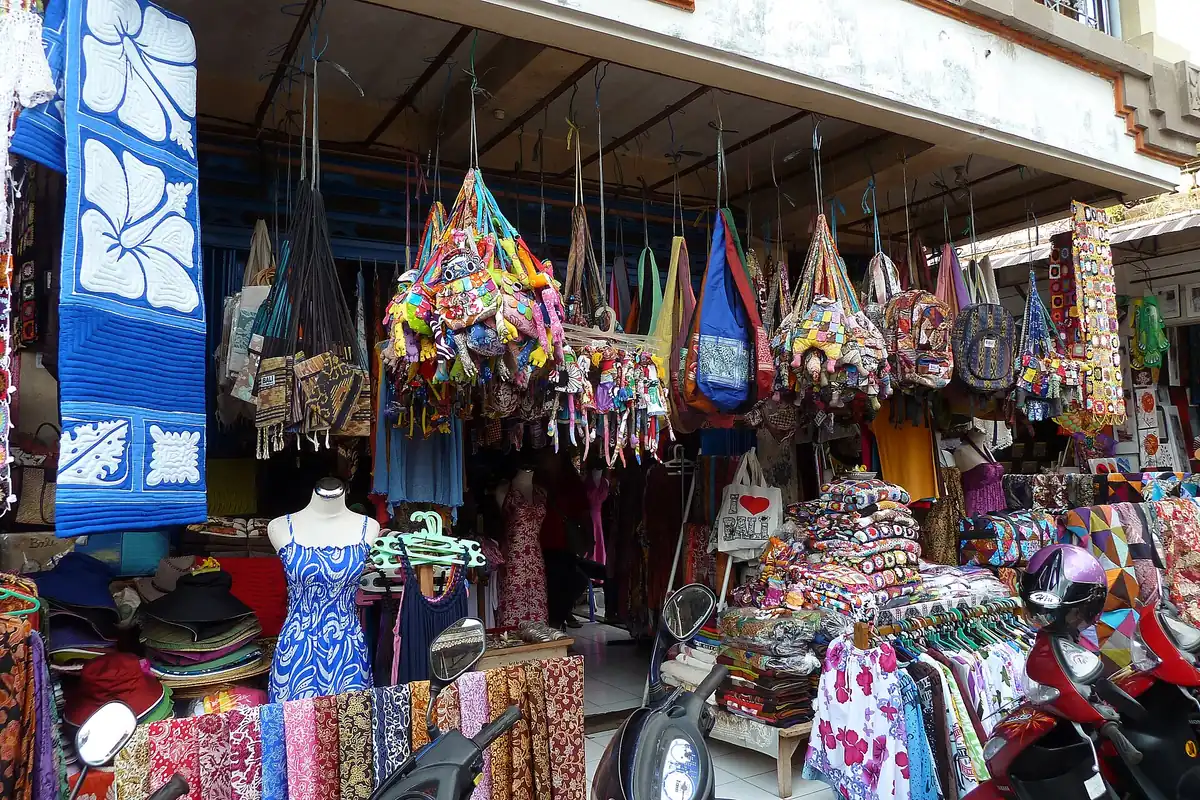 A market stall of colourful fabrics and souvenirs
