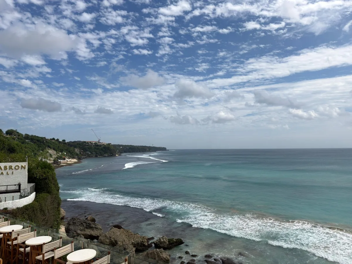 An ocean view from a high cliff above the beach
