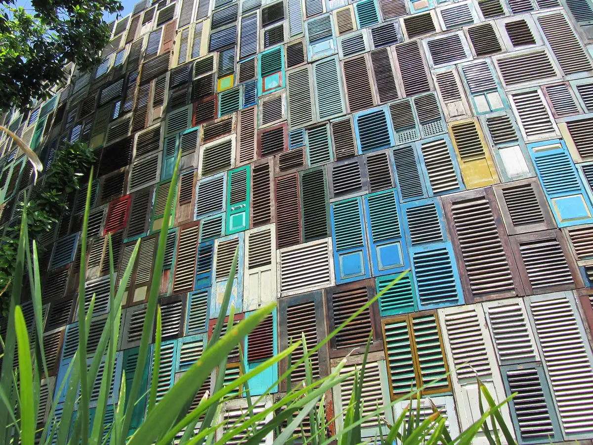 A facade built from coloured wooden shutters
