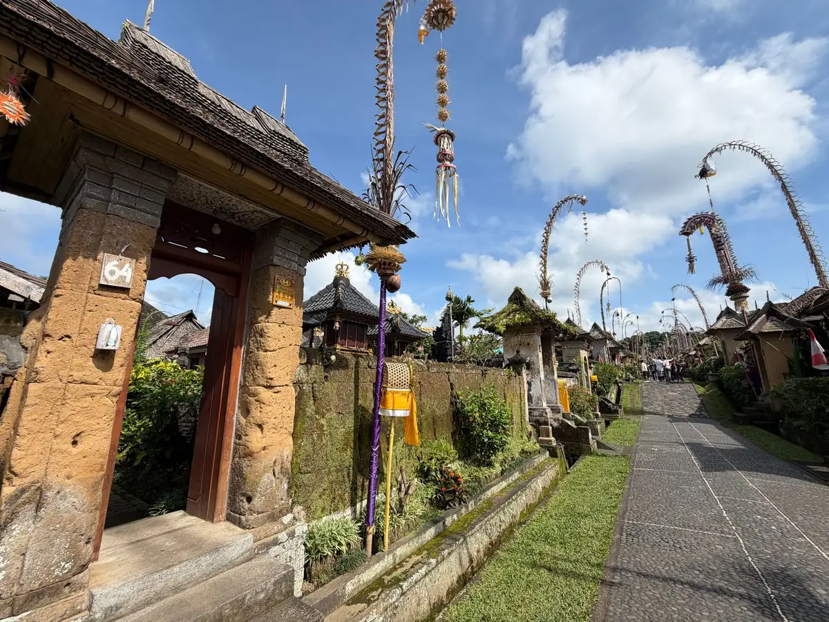 A traditional Balinese gate and a village street