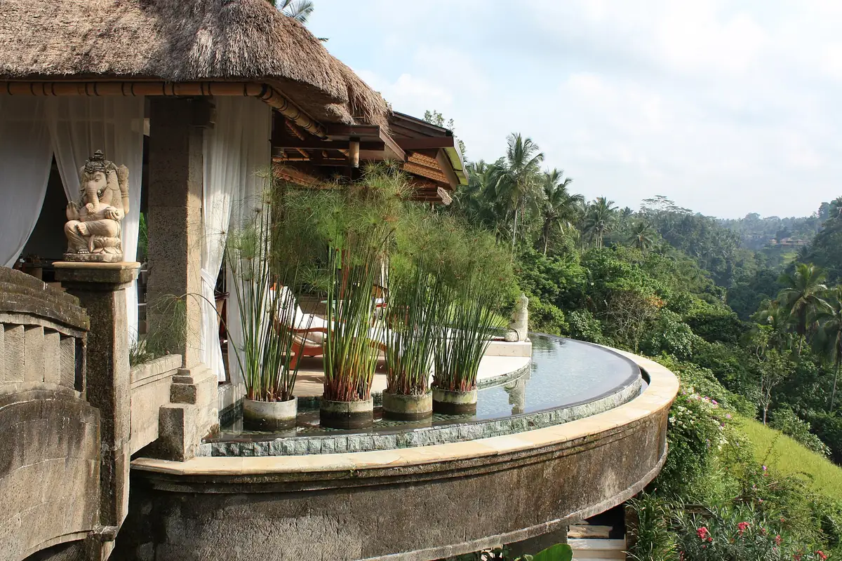 A Balinese thatched pavilion above a green valley