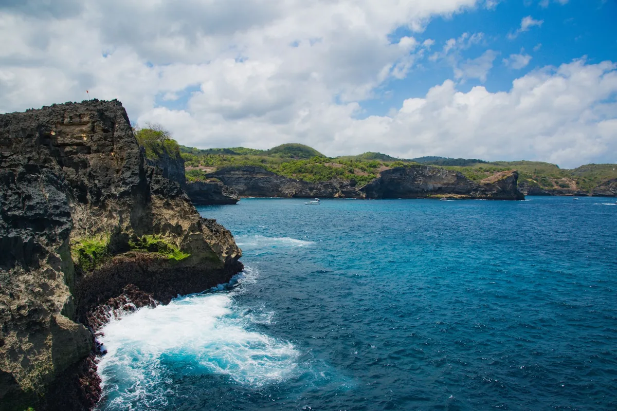 Coastal cliffs and vivid blue water